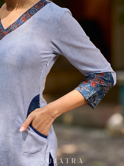 Dussehra Sale — chic blue striped kurta adorned with peeking ajrakh accents on the pocket and sleeves.