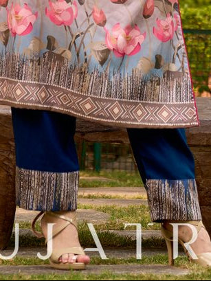 Soft, flowy teal blue rayon pants adorned with modern abstract printed borders.