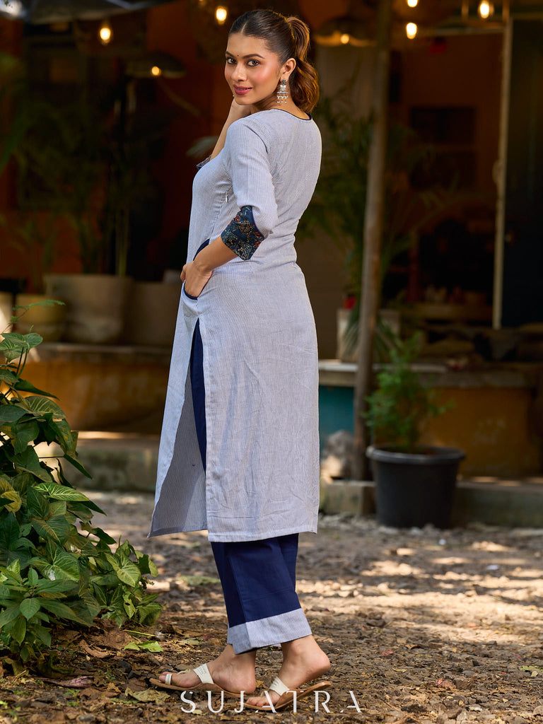 chic blue striped kurta adorned with peeking ajrakh accents on the pocket and sleeves.