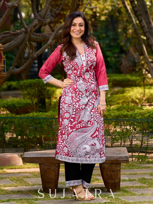 Rich mulberry pink kurta showcasing all-over Kalamkari print with balanced white and black accents