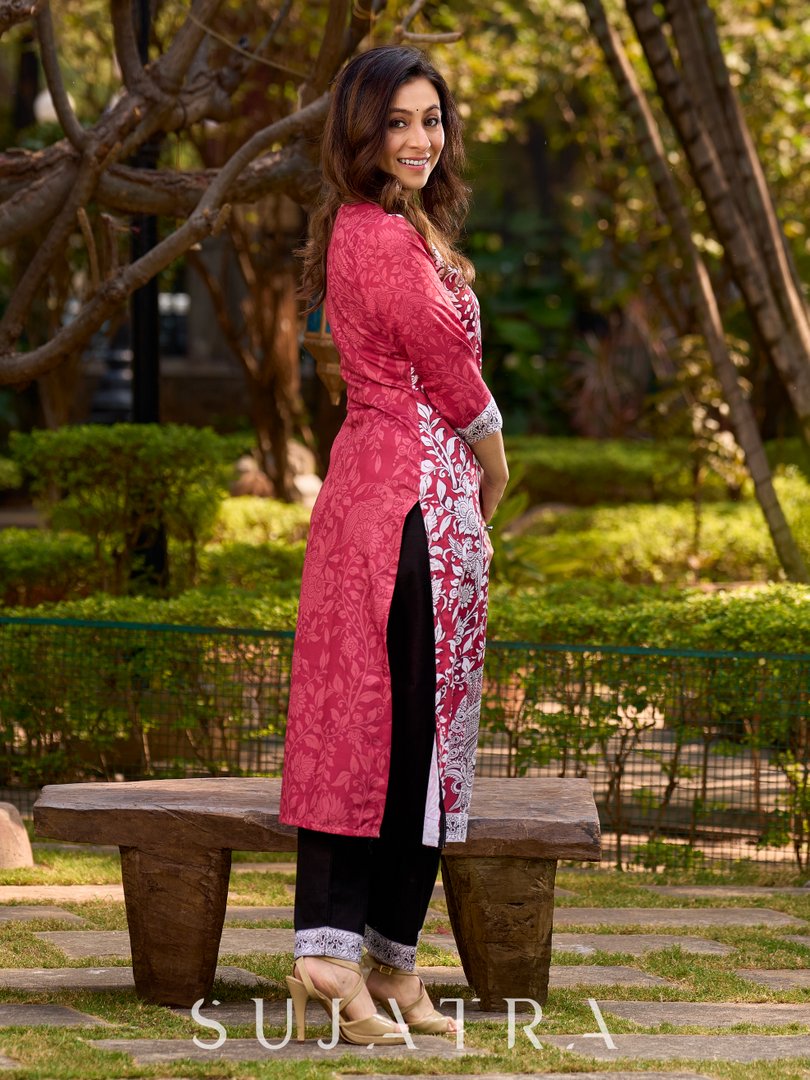 Rich mulberry pink kurta showcasing all-over Kalamkari print with balanced white and black accents