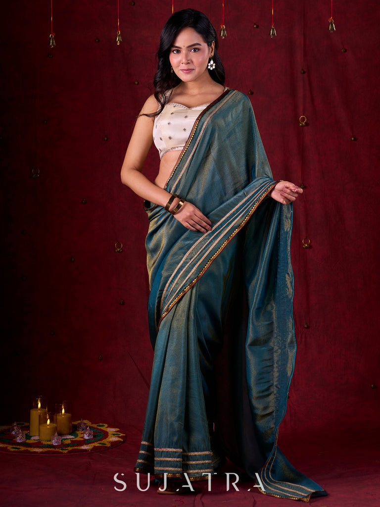 Teal Blue Tissue Saree with Zari Border & Minimal Detailing