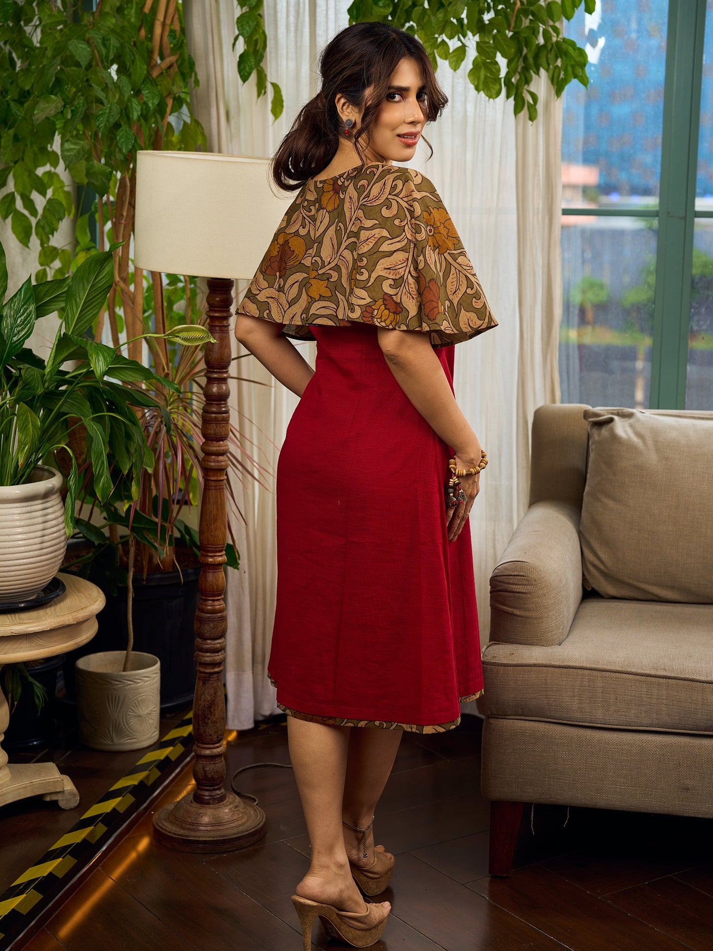 Elegant maroon dress featuring an attached artisan Kalamkari shoulder cape.