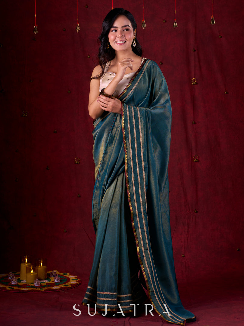 Teal Blue Tissue Saree with Zari Border & Minimal Detailing