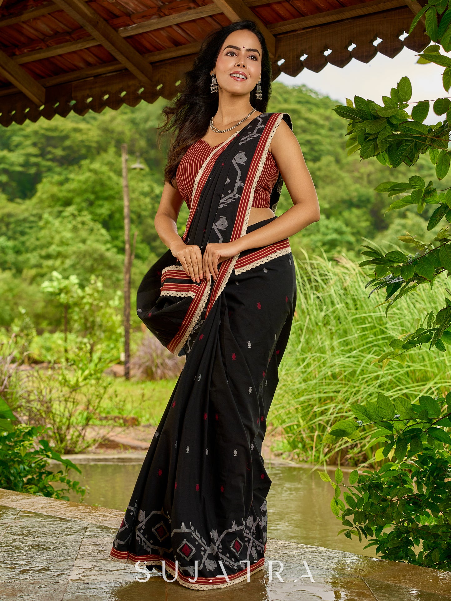 Heritage black cotton saree blending Jamdani-inspired weaves with Ajrakh elegance