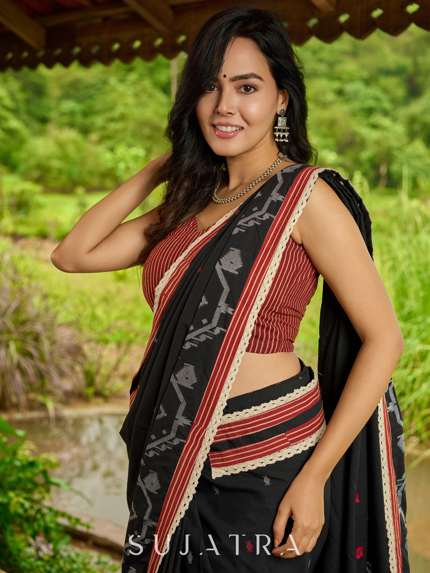 Heritage black cotton saree blending Jamdani-inspired weaves with Ajrakh elegance