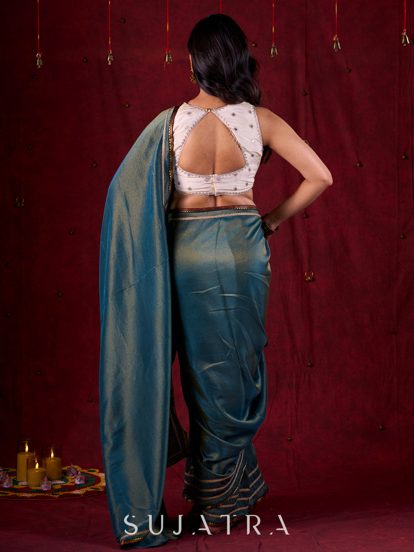 Teal Blue Tissue Saree with Zari Border & Minimal Detailing