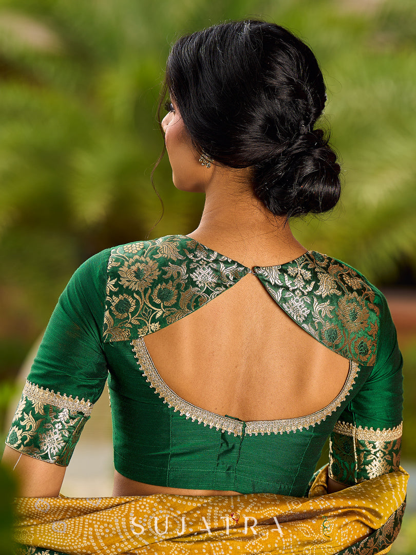 Exquisite Mustard Bandhani Print Saree with Green Benarasi Border & Tasseled Pallu with Hand Embroidered Mirror Work