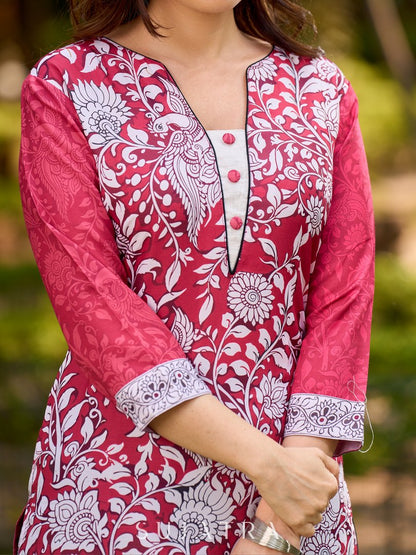 Rich mulberry pink kurta showcasing all-over Kalamkari print with balanced white and black accents