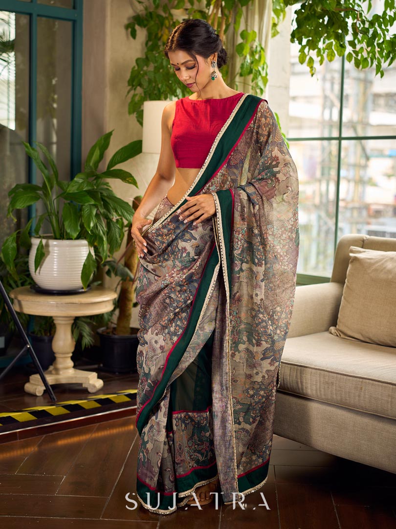 Regal Bottle Green Georgette Saree with Artistic Kalamkari Printed Pallu & Delicate Gold Lace Border
