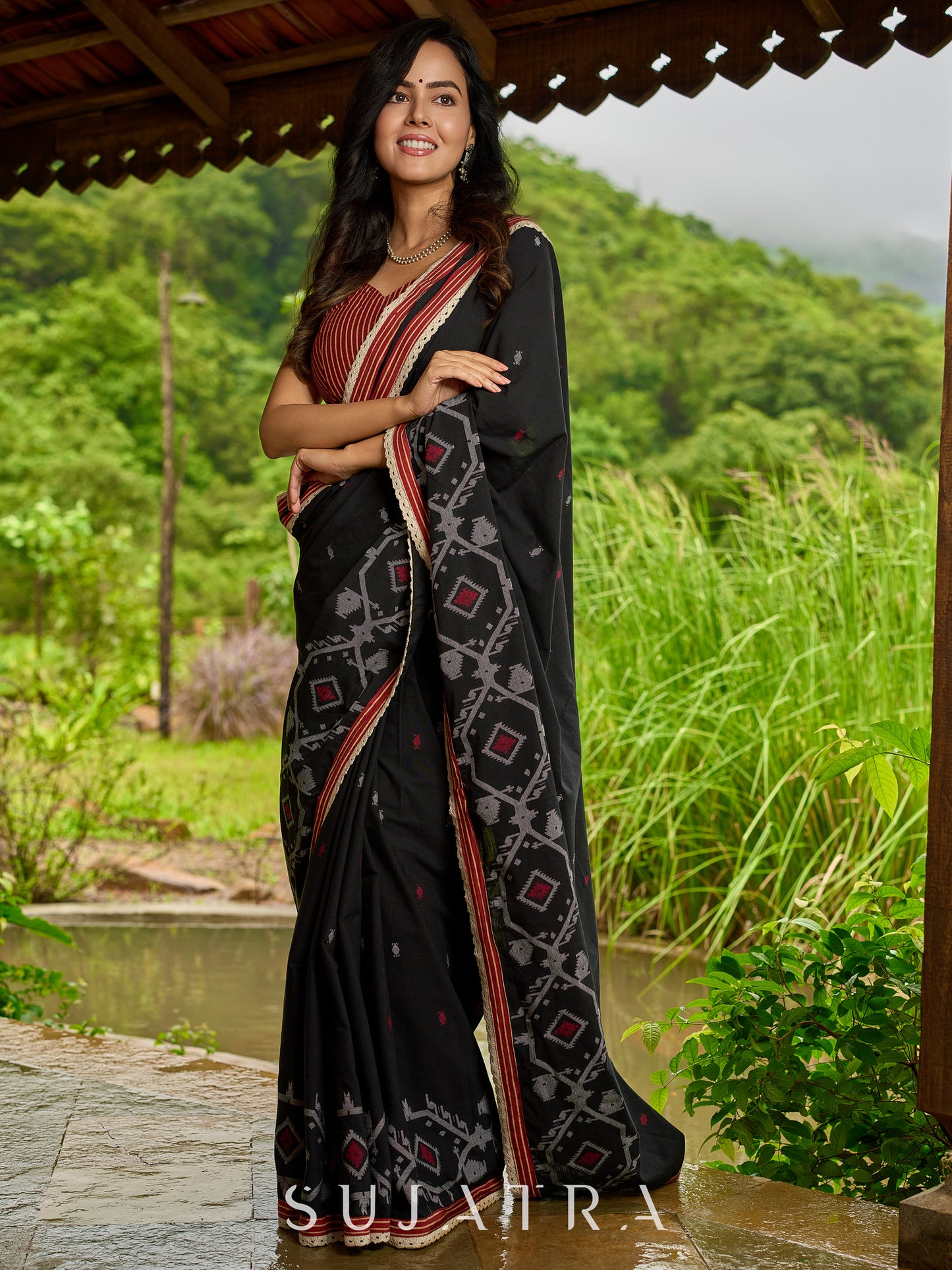 Heritage black cotton saree blending Jamdani-inspired weaves with Ajrakh elegance