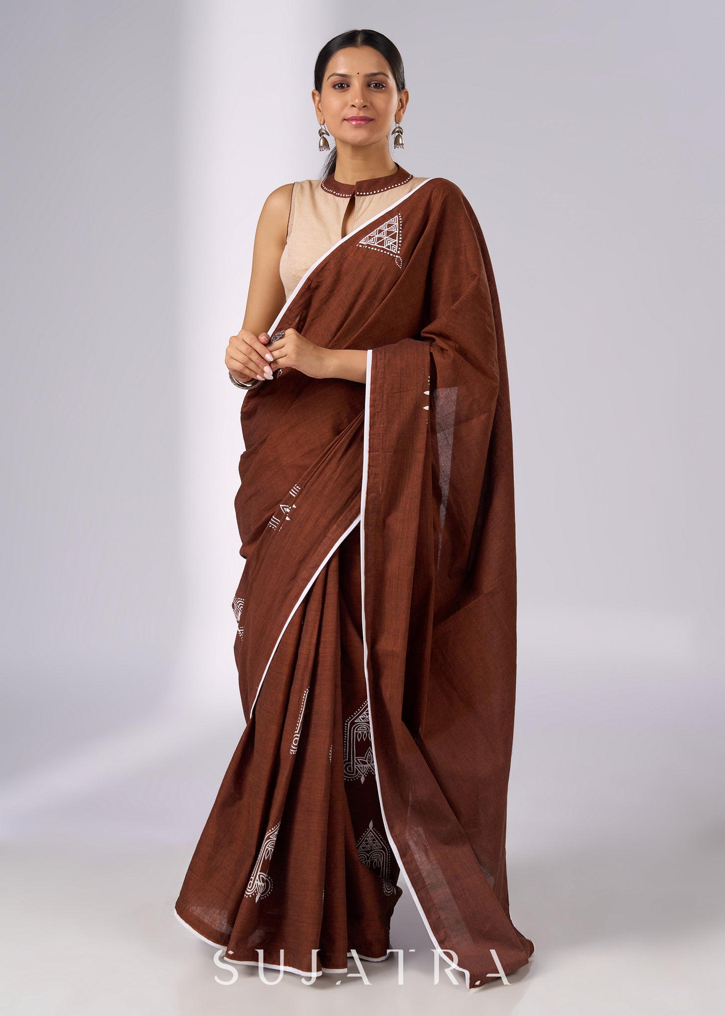 Minimalist brown cotton saree with sophisticated hand painting motifs