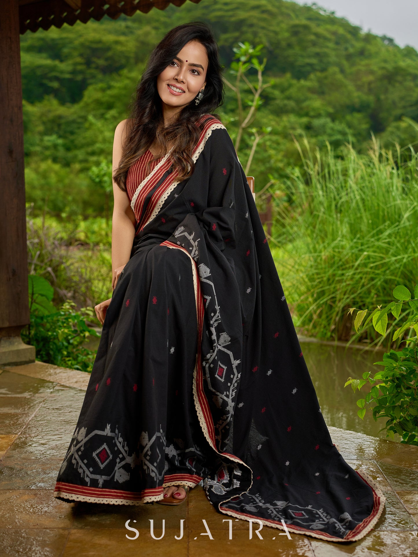 Heritage black cotton saree blending Jamdani-inspired weaves with Ajrakh elegance