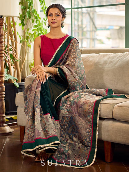 Regal Bottle Green Georgette Saree with Artistic Kalamkari Printed Pallu & Delicate Gold Lace Border