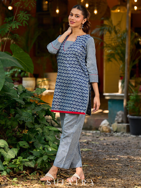 chic indigo short kurta featuring a floral stripe fusion and vibrant red piping.