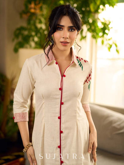 Off-white dandelion pleated shirt dress featuring dandelion placement block prints, checkered block-printed collar and cuffs, and red accents for a fresh, artisanal everyday look.