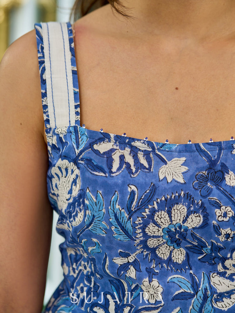 Vibrant Blue Floral Printed Cotton Flared Dress, Square Neckline with Straps, and Intricate Bead and Crochet Lace Detailings