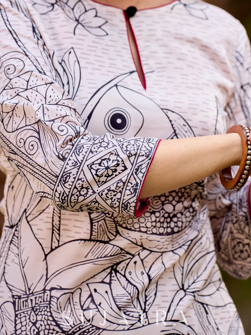 Elegant off-white and black kurta featuring Madhubani fish motifs with rich maroon accents