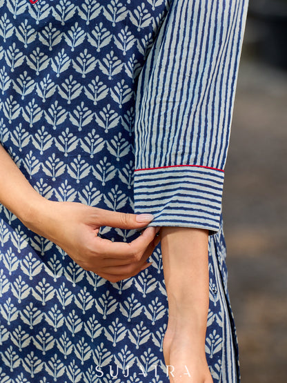 chic indigo short kurta featuring a floral stripe fusion and vibrant red piping.