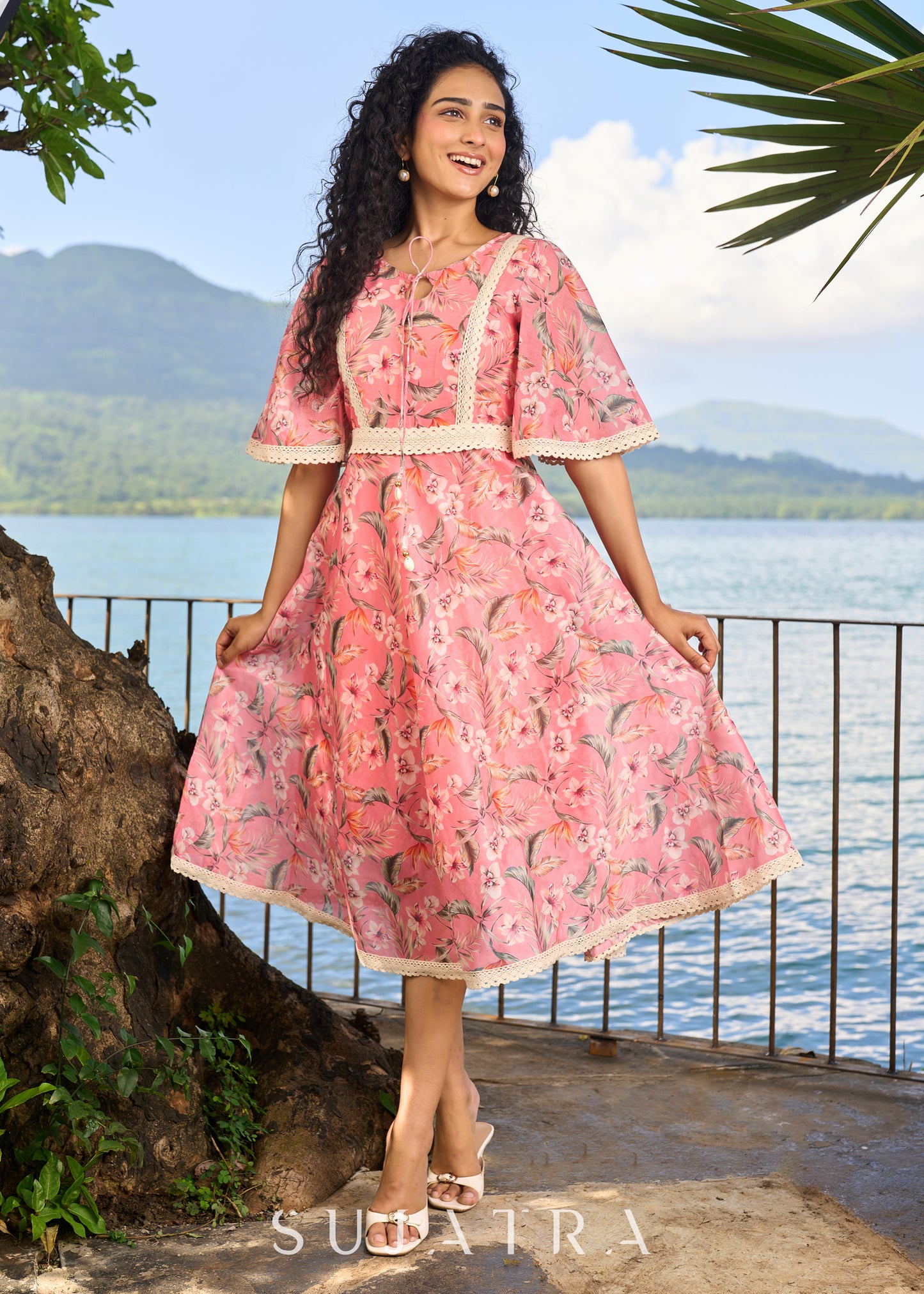 Beautiful light pink chanderi floral printed dress highlighted with macrame lace