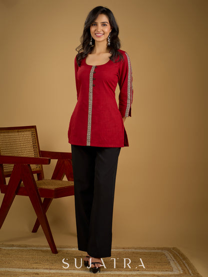 Elegant maroon cotton top highlighted with beautiful border detailing.