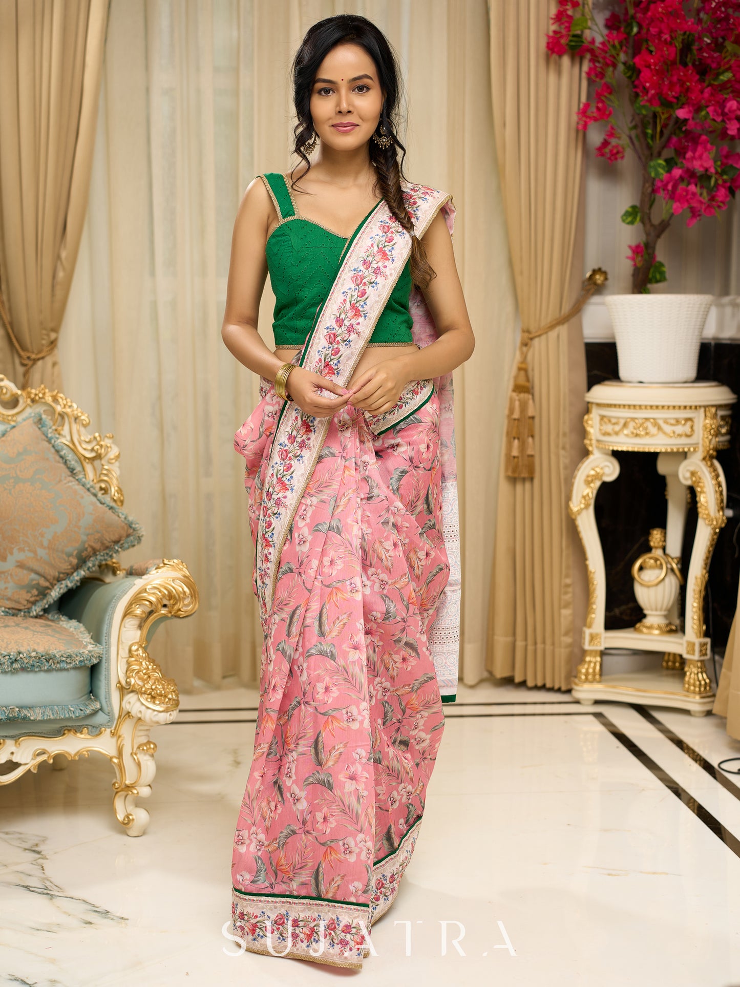 Blush pink floral fantasy chanderi saree draped with embroidered border