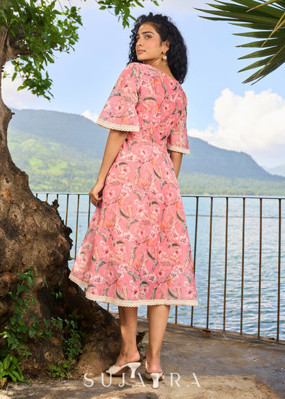 Beautiful light pink chanderi floral printed dress highlighted with macrame lace