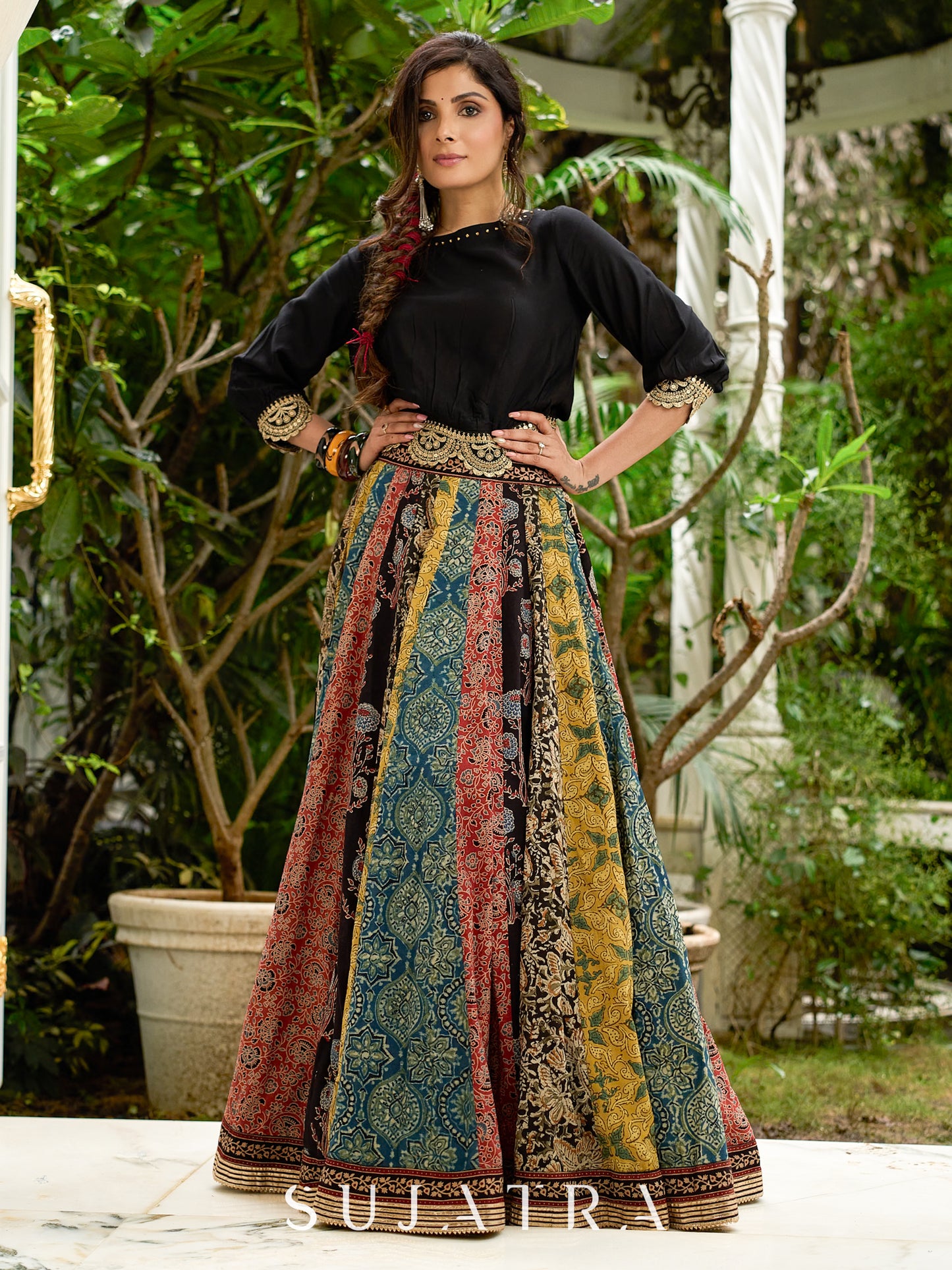 Modern colourful Ajrakh lehenga beautifully contrasted by a sleek black gathered topwear.