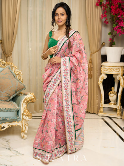 Blush pink floral fantasy chanderi saree draped with embroidered border