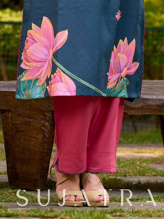 Elegant soft pink rayon straight pants finished with contrast teal piping