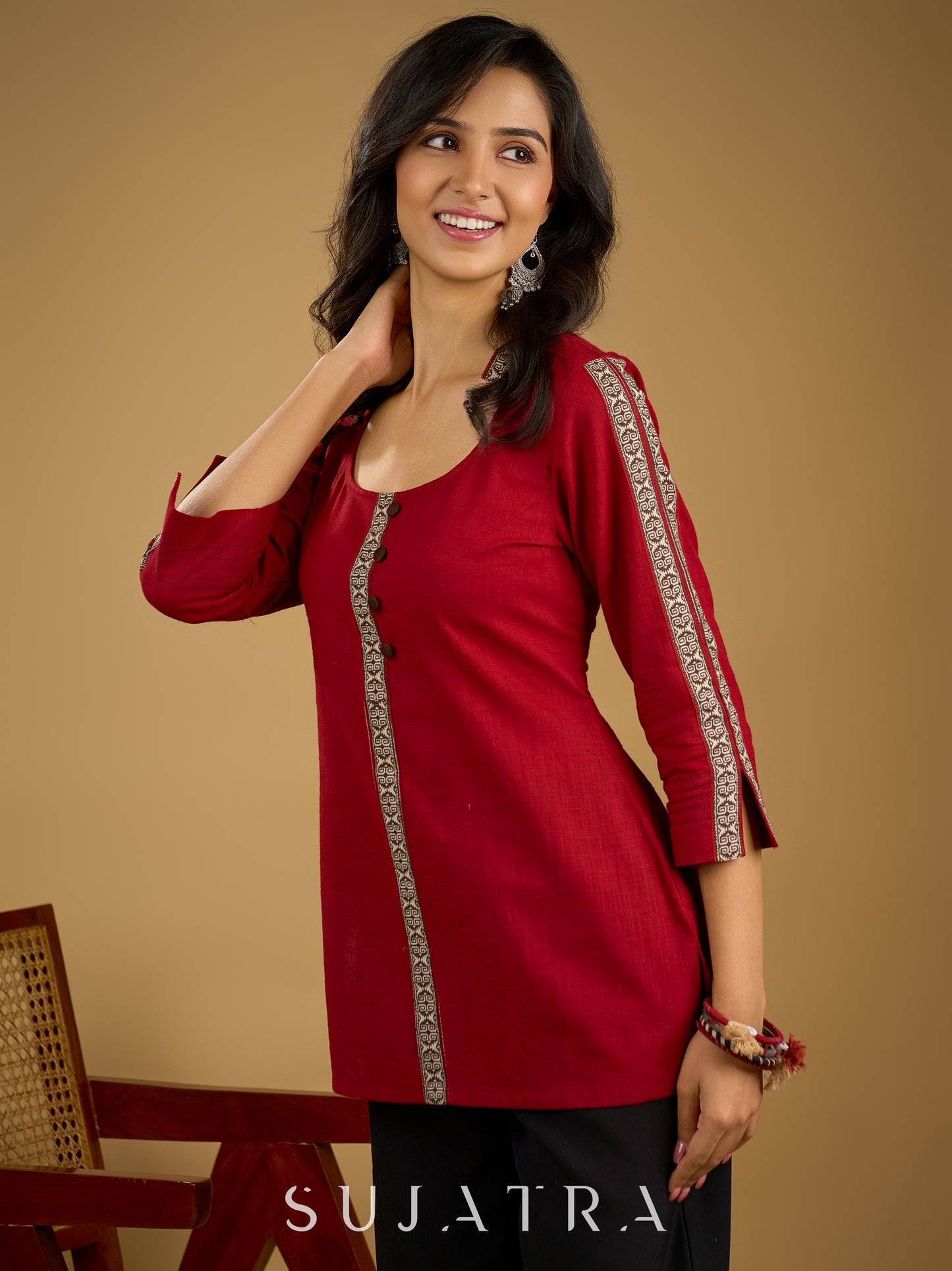 Elegant maroon cotton top highlighted with beautiful border detailing.