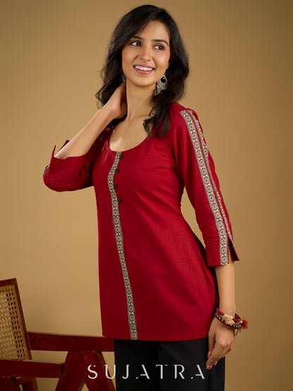 Elegant maroon cotton top highlighted with beautiful border detailing.