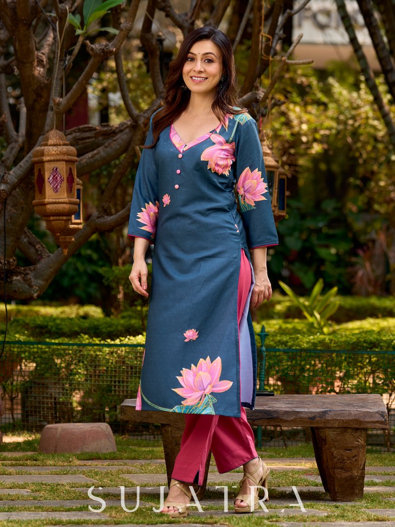 Graceful teal kurta with delicate pink lotus printing, subtle pink accents, and a statement patch above the neckline.