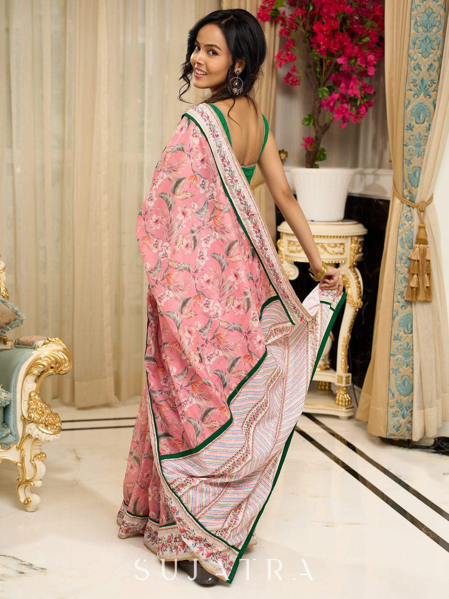 Blush pink floral fantasy chanderi saree draped with embroidered border