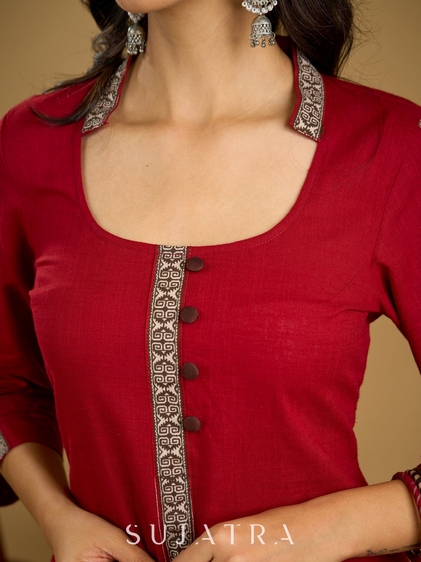 Elegant maroon cotton top highlighted with beautiful border detailing.