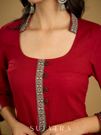 Elegant maroon cotton top highlighted with beautiful border detailing.