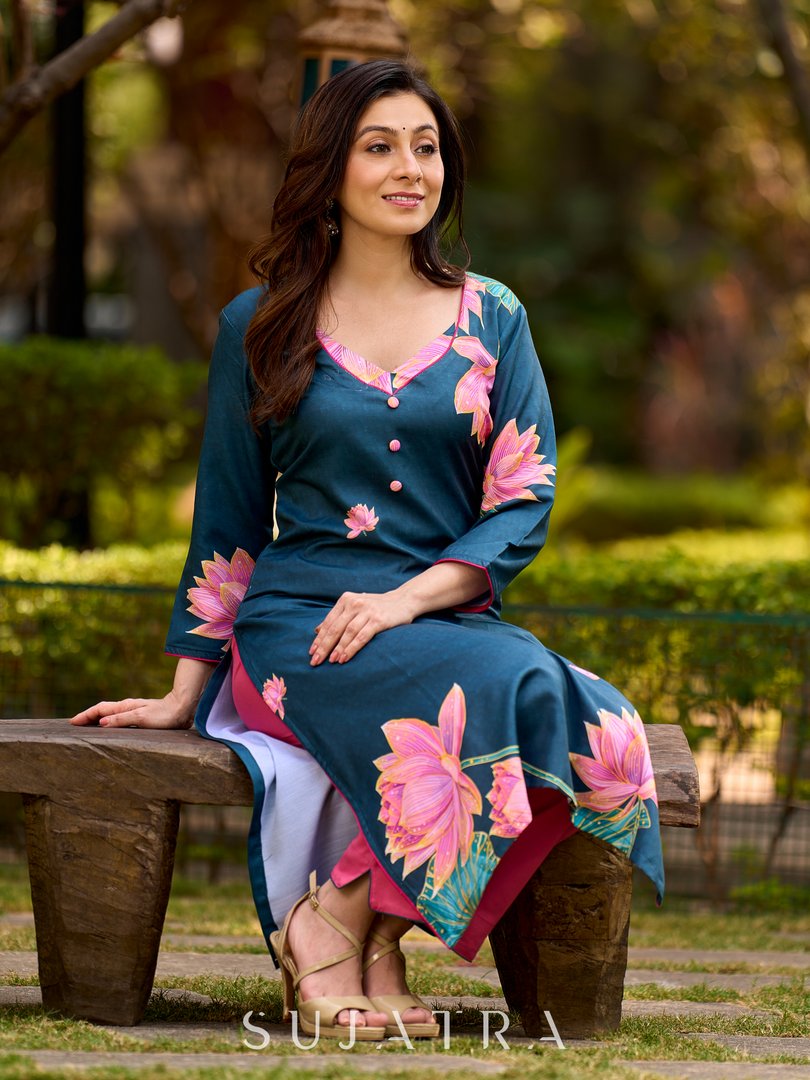 Graceful teal kurta with delicate pink lotus printing, subtle pink accents, and a statement patch above the neckline.