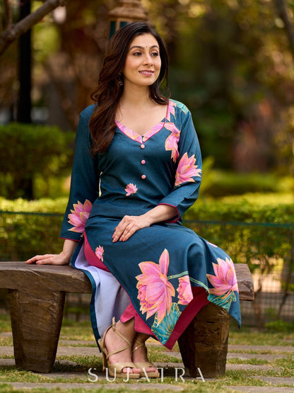 Graceful teal kurta with delicate pink lotus printing, subtle pink accents, and a statement patch above the neckline.