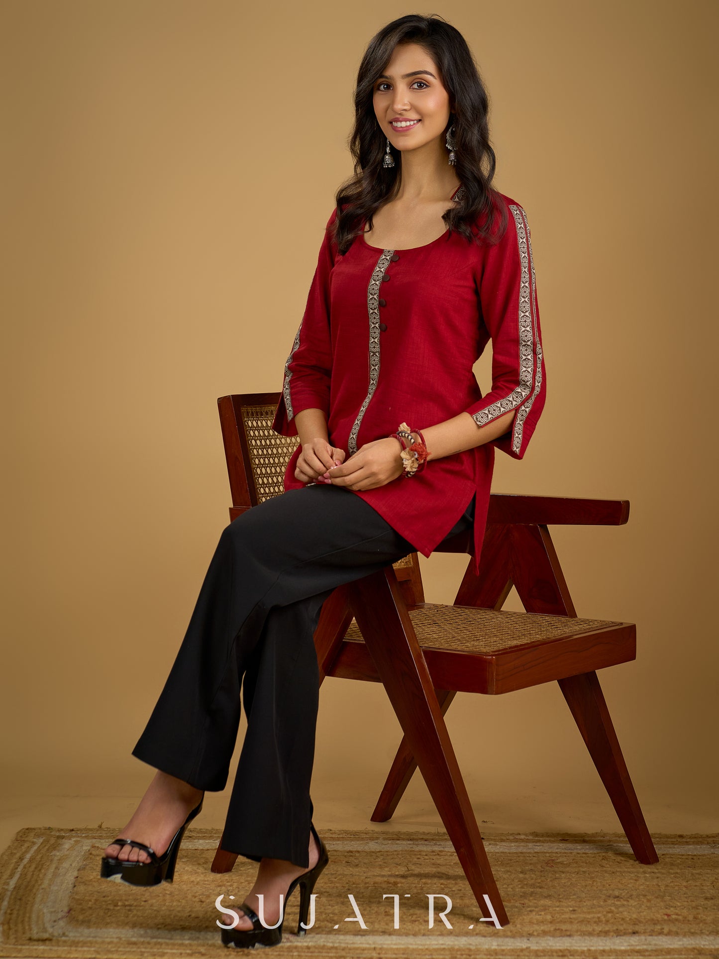 Elegant maroon cotton top highlighted with beautiful border detailing.