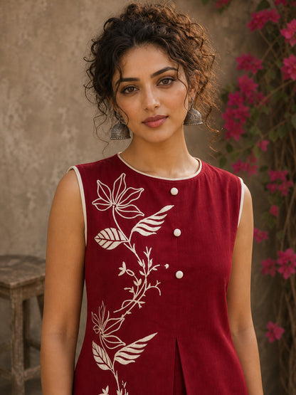 Charming red hand block print top showcasing elegant floral motifs, a contemporary pleated silhouette, and refined detailing, blending artisanal craftsmanship with effortless everyday style.