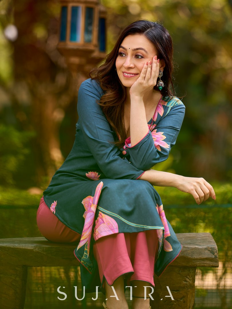 Graceful teal kurta with delicate pink lotus printing, subtle pink accents, and a statement patch above the neckline.