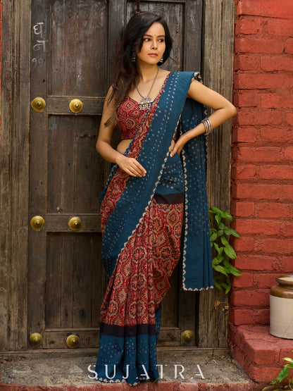 Fusion of Ajrakh charm and Bandhej flair. Rust & Teal cotton Saree