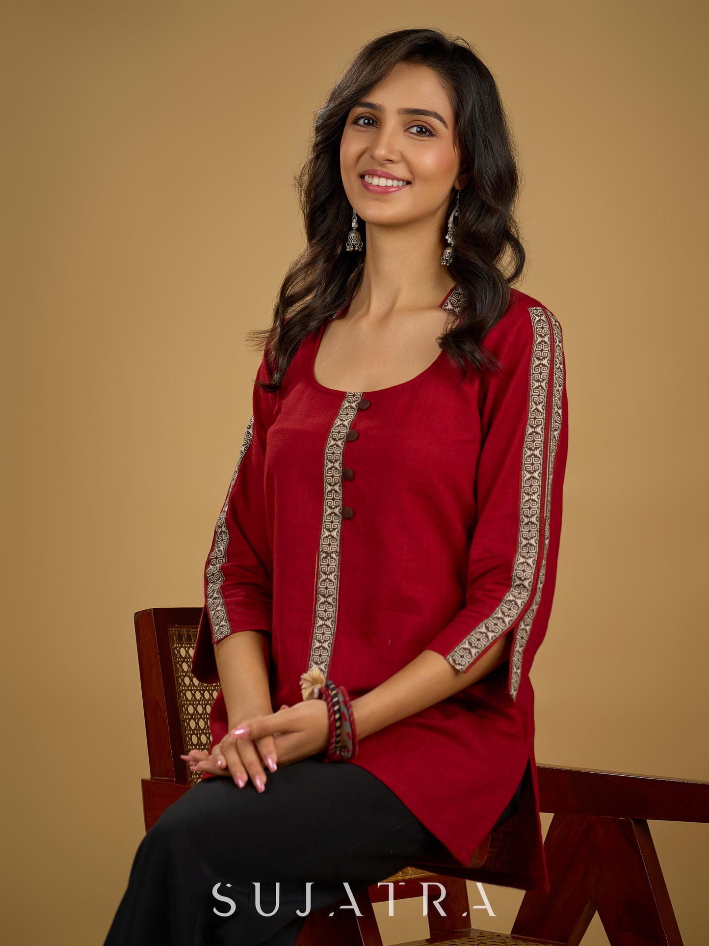 Elegant maroon cotton top highlighted with beautiful border detailing.
