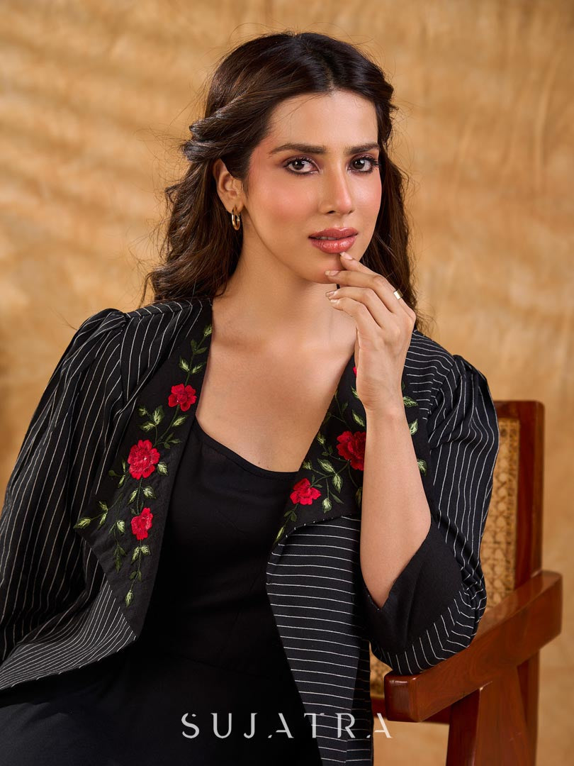 Exquisite black Ikat jacket with offset collar flaps and detailed red floral vine embroidery, delivering a sculpted, high-impact silhouette with refined presence for corporate styling.