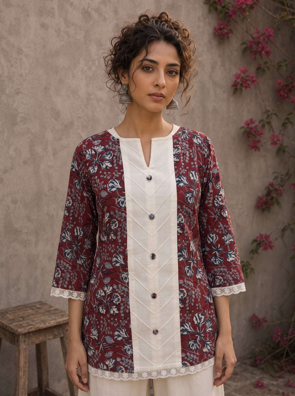 Deep red Jaipur floral printed top featuring maroon pintuck yoke, off-white panel, and scalloped lace detailing.