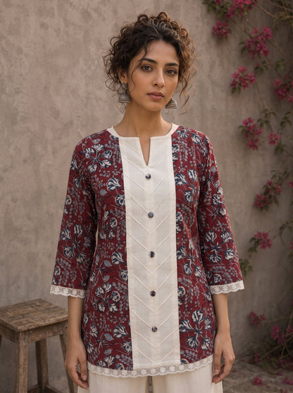 Deep red Jaipur floral printed top featuring maroon pintuck yoke, off-white panel, and scalloped lace detailing.