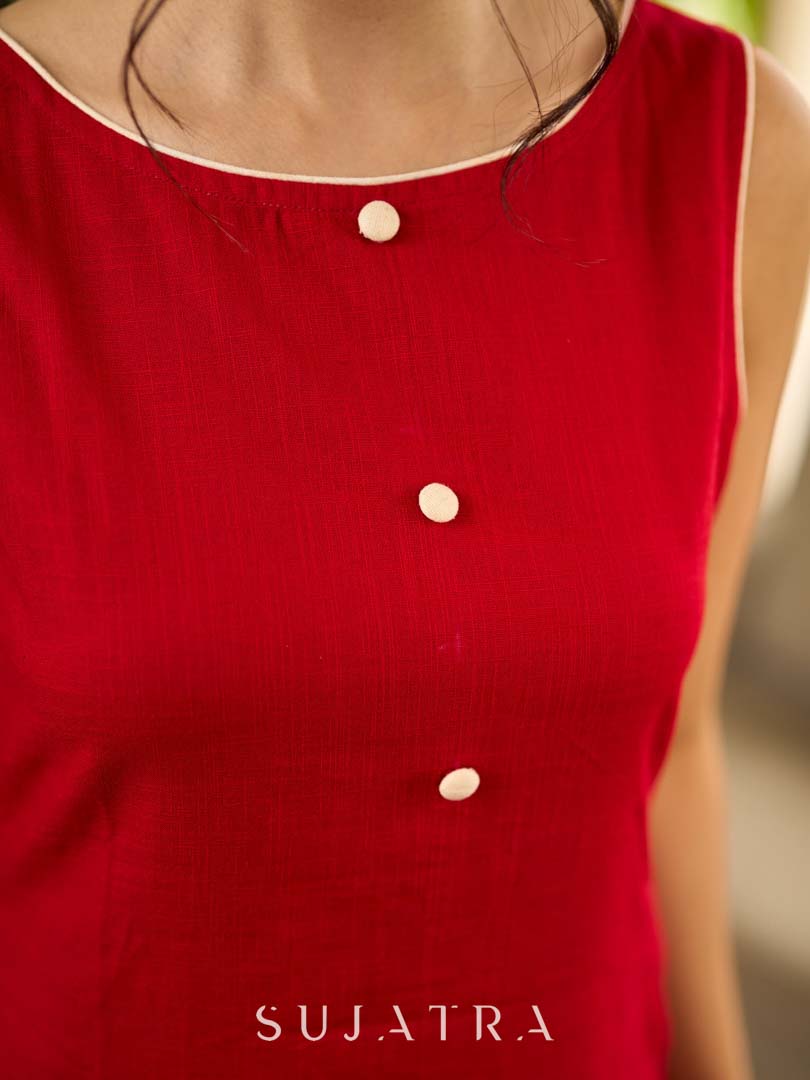 Vibrant red sleeveless dress with a bold off-white floral hand block print at the hem and clean off-white edging for a striking, handcrafted-inspired finish.