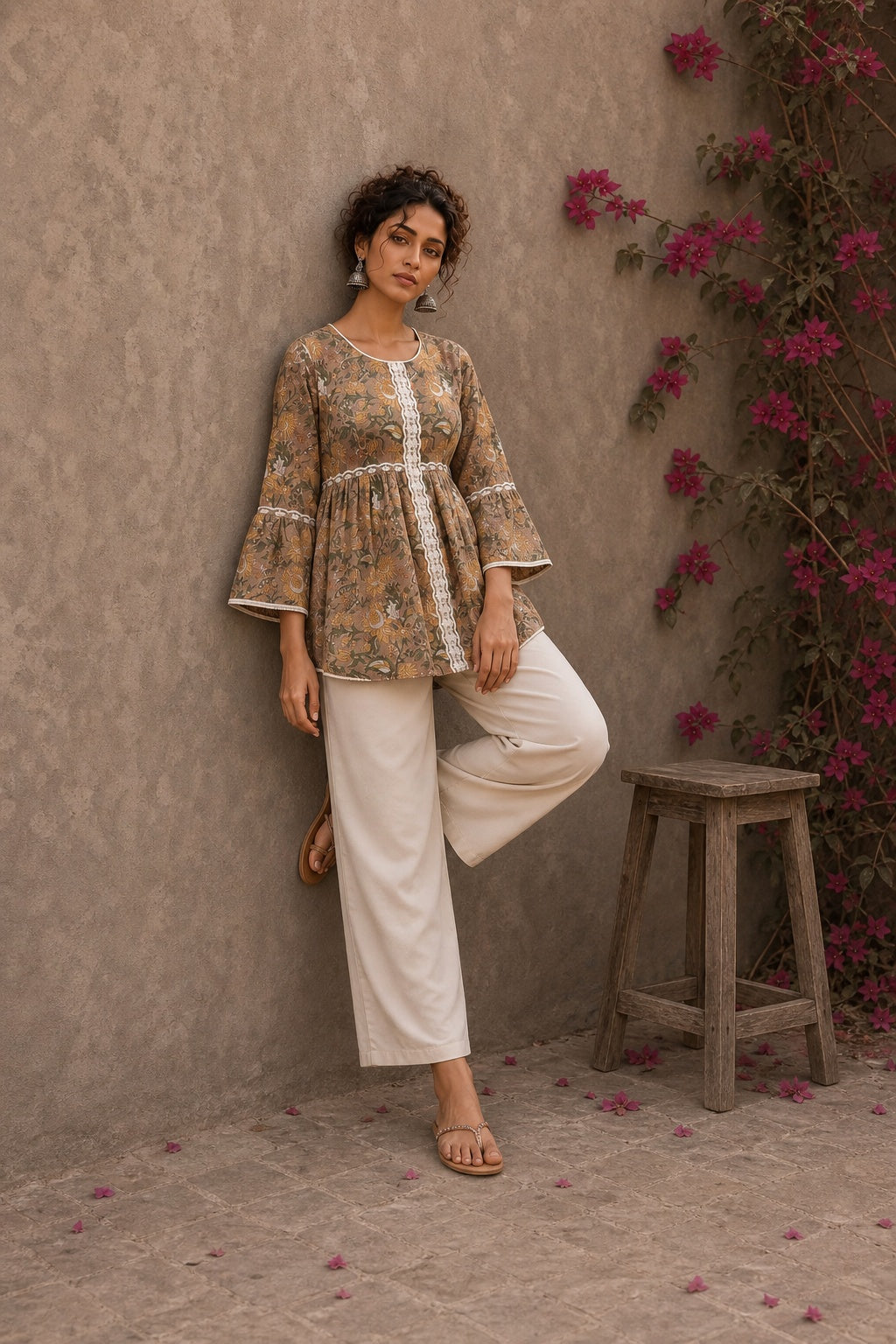 Romantic peach Jaipur floral top adorned with scalloped lace, gathered sleeve hems, and playful tie-knot accents.