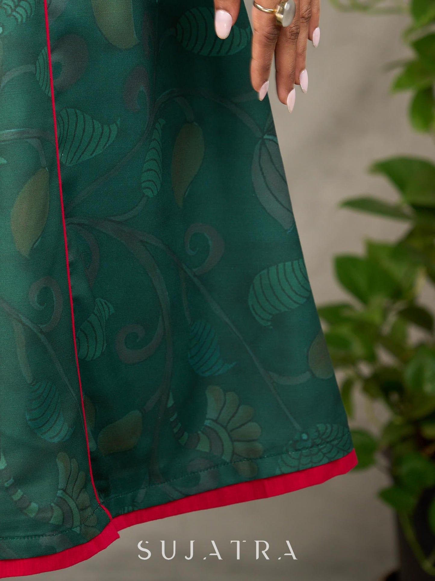 Bottle green Madhubani printed dress with vibrant magenta accents.
