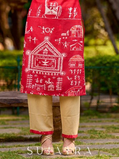Culturally rooted red kurta displaying classic Warli designs with subtle beige touches